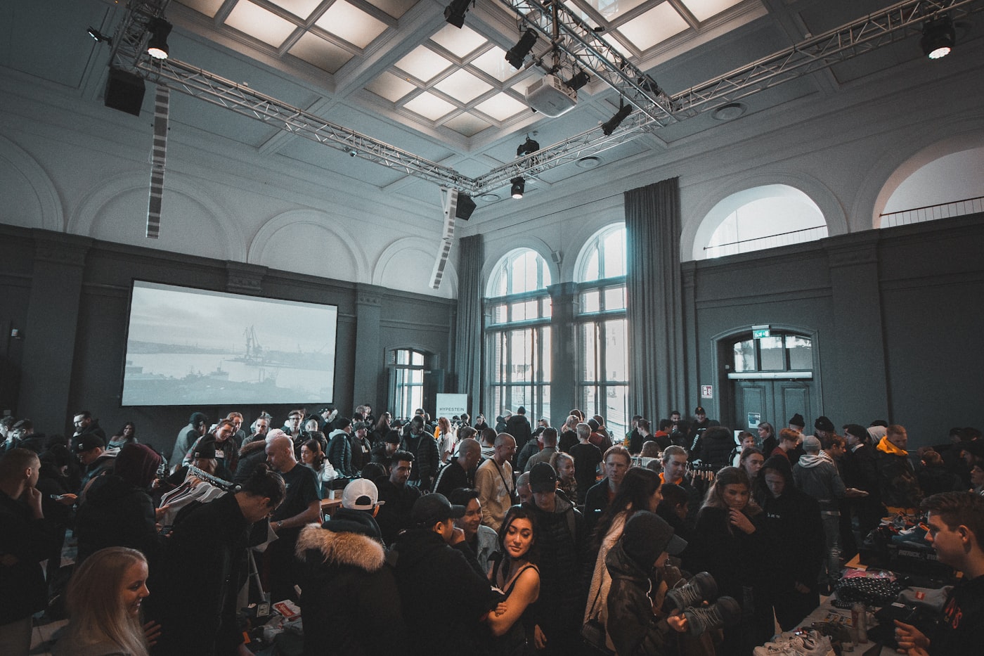 A packed conference hall of women networking